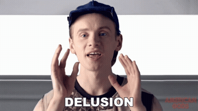A Man Is Making A Funny Face And The Word Delusion Is On The Screen GIF
