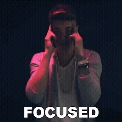 A Man Is Making A Funny Face And The Word Focused Is Above Him GIF