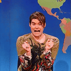 A Man Is Making A Funny Face In Front Of A Map GIF