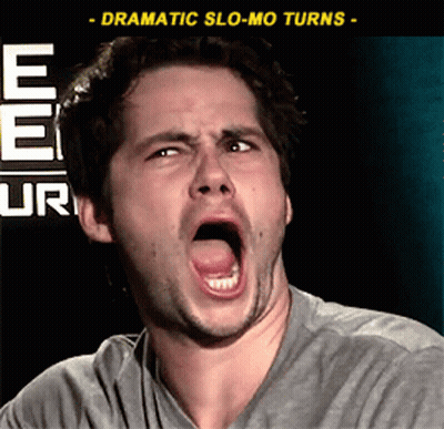 A Man Is Making A Funny Face In Front Of A Sign That Says Ee Ur GIF