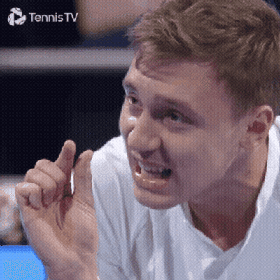 A Man Is Making A Funny Face In Front Of A Tennis Tv Sign GIF