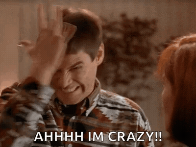 A Man Is Making A Funny Face While Holding A Piece Of Paper In His Hand . GIF