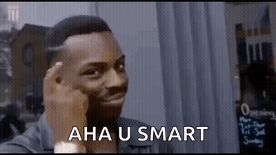 A Man Is Making A Funny Face While Holding His Finger To His Forehead And Says `` Aha U Smart '' . GIF