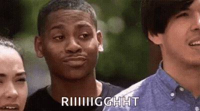 A Man Is Making A Funny Face While Standing Next To A Woman And Another Man . GIF