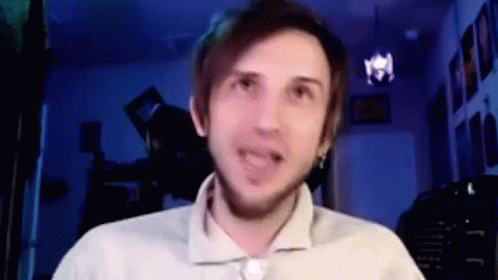 A Man Is Making A Funny Face While Talking On A Video Call . GIF