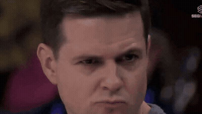 A Man Is Making A Funny Face With His Eyes Closed . GIF