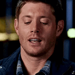 A Man Is Making A Funny Face With His Eyes Closed . GIF