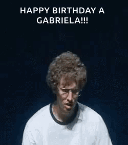 A Man Is Making A Funny Face With His Hands In The Air While Wearing Glasses . GIF