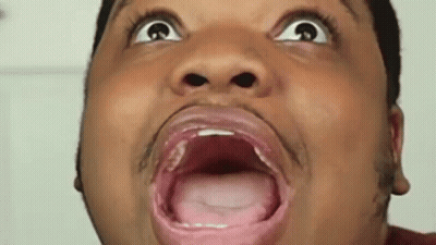 A Man Is Making A Funny Face With His Mouth Open And His Tongue Out . GIF