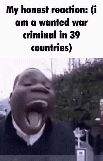 A Man Is Making A Funny Face With His Mouth Open And His Tongue Sticking Out . GIF