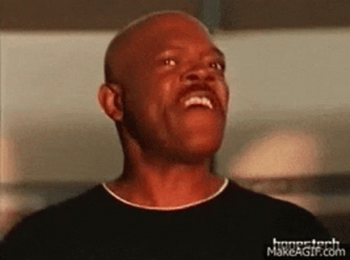 A Man Is Making A Funny Face With His Mouth Open . GIF