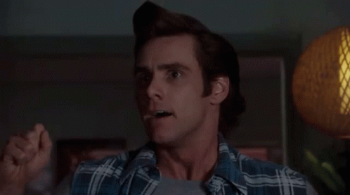 A Man Is Making A Funny Face With His Mouth Open . GIF