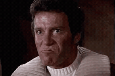 A Man Is Making A Funny Face With His Mouth Open . GIF