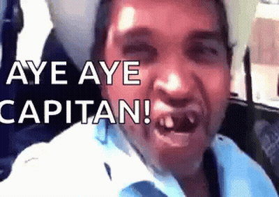 A Man Is Making A Funny Face With The Words Aye Aye Capitan Written Above Him GIF