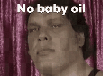 A Man Is Making A Funny Face With The Words `` No Baby Oil '' . GIF