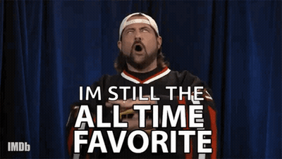 A Man Is Making A Gesture With His Hands And Says Im Still The All Time Favorite . GIF