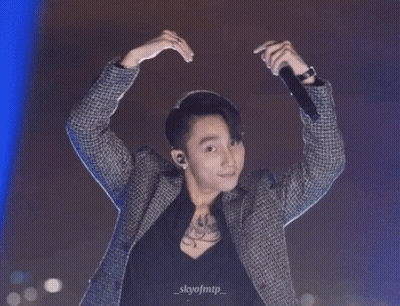 A Man Is Making A Heart Shape With His Hands And The Name Skyofmtp Is On The Bottom Right GIF