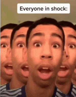 A Man Is Making A Shocked Face In Front Of A Sign That Says Everyone In Shock GIF