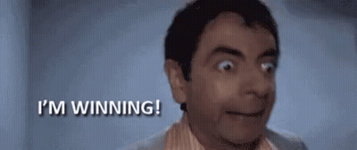 A Man Is Making A Surprised Face And Saying `` I 'M Winning ! '' GIF