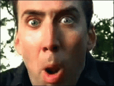 A Man Is Making A Surprised Face With His Mouth Open GIF