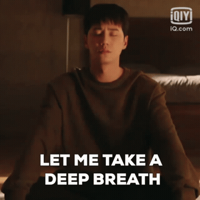 A Man Is Meditating With His Eyes Closed And Saying Let Me Take A Deep Breath GIF