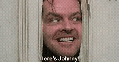 A Man Is Peeking Through A Door And Saying `` Here 'S Johnny ! '' GIF
