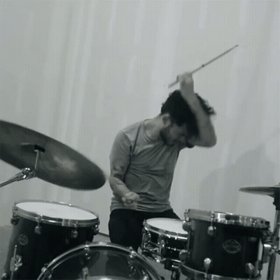 A Man Is Playing A Drum Set With A Cymbal That Says Sabian GIF