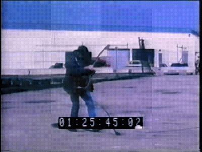 A Man Is Playing A Guitar In A Parking Lot With A Timer That Says 01:25:02 GIF
