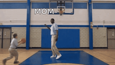 A Man Is Playing Basketball With A Child And The Word Mom Is On The Wall GIF