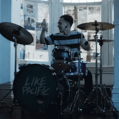 A Man Is Playing Drums With A Drum Set That Says Like Pacific GIF
