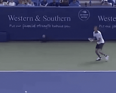 A Man Is Playing Tennis In Front Of A Sign That Says Western & Southern Put Our Financial Strength Behind You GIF