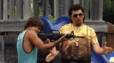 A Man Is Pointing A Gun At Another Man While Wearing Sunglasses . GIF