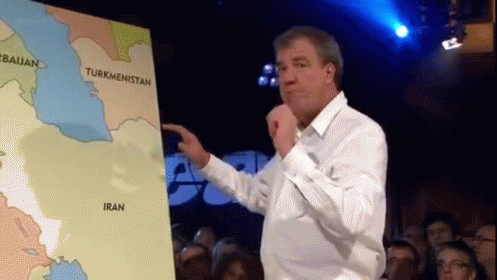 A Man Is Pointing At A Map Of Iran And Turkmenistan GIF