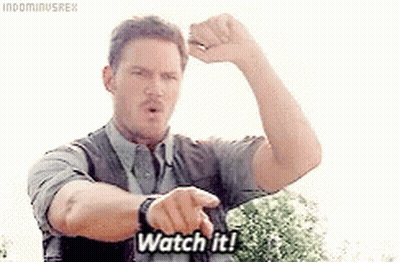 A Man Is Pointing At His Watch And Says `` Watch It '' . GIF