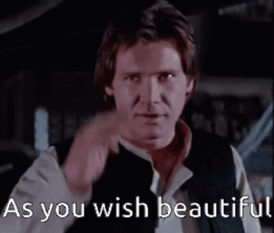 A Man Is Pointing At The Camera With The Words As You Wish Beautiful Behind Him GIF