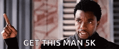 A Man Is Pointing Up And Saying Get This Man 5K GIF