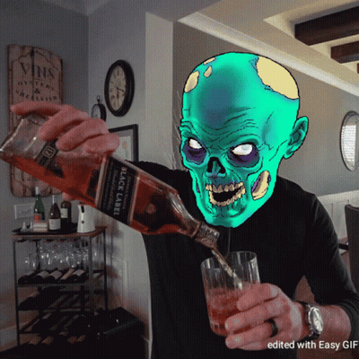 A Man Is Pouring A Bottle Of Black Label Scotch Into A Glass GIF