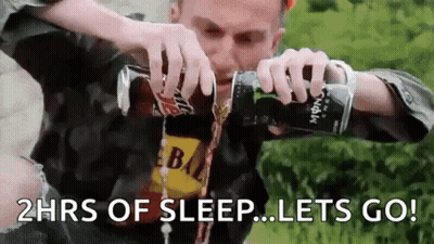 A Man Is Pouring Energy Drink Into His Mouth . GIF