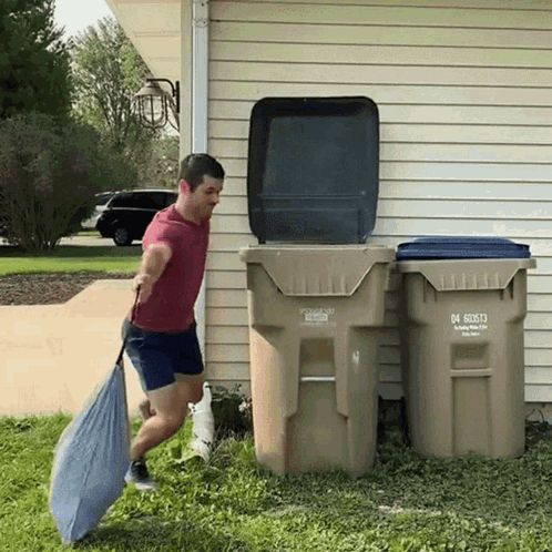 A Man Is Pushing A Garbage Can That Has The Number 04 60573 On It GIF
