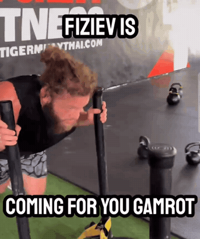A Man Is Pushing A Sled With The Words Coming For You Gamrot On The Bottom GIF