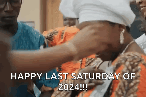 A Man Is Putting A Necklace On A Woman 'S Neck And Says Happy Last Saturday Of 2024 GIF