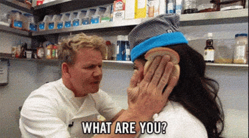 A Man Is Putting A Piece Of Bread On A Woman 'S Face And Asking What Are You . GIF