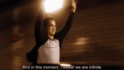 A Man Is Raising His Arms In The Air And Saying `` And In This Moment , I Swear We Are Infinite '' GIF