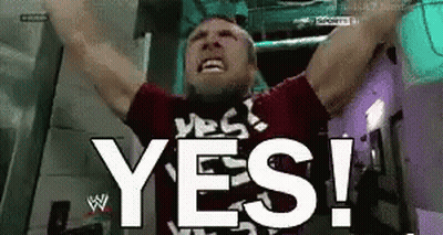 A Man Is Raising His Arms In The Air And Says Yes ! GIF