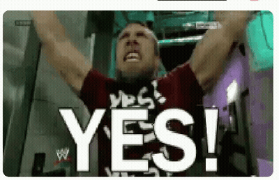 A Man Is Raising His Arms In The Air And Says Yes ! GIF