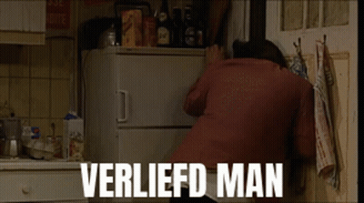 A Man Is Reaching Into A Refrigerator With The Words Verliefd Man Written On The Bottom GIF