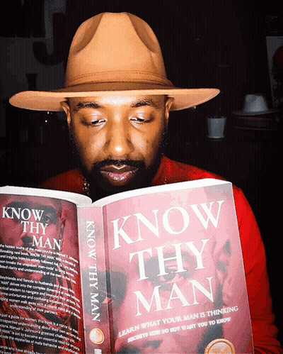 A Man Is Reading A Book Titled Know Thy Man GIF