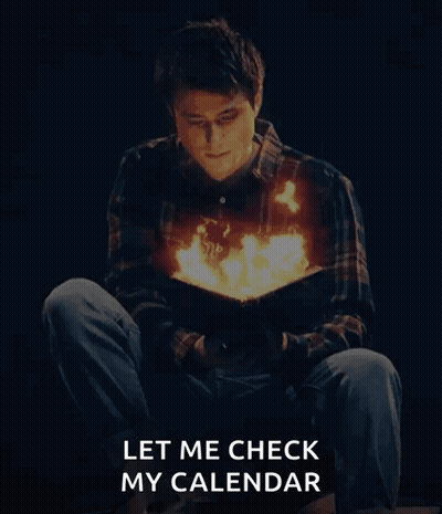 A Man Is Reading A Book With Fire Coming Out Of His Chest GIF