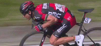 A Man Is Riding A Bike With The Number 41 On The Back Of His Jersey GIF