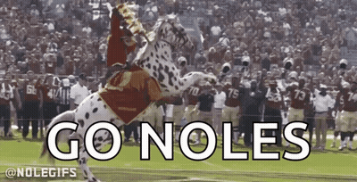 A Man Is Riding A Dalmatian Horse With The Words Go Noles Written On It GIF